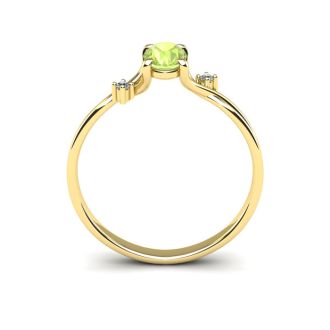 1/2 Carat Oval Shape Peridot and Two Diamond Accent Ring In 14 Karat Yellow Gold
