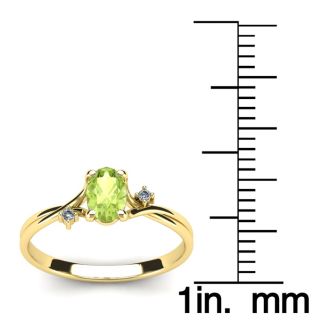 1/2 Carat Oval Shape Peridot and Two Diamond Accent Ring In 14 Karat Yellow Gold