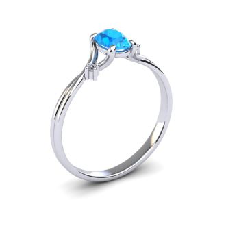 1/2 Carat Oval Shape Blue Topaz and Two Diamond Accent Ring In 14 Karat White Gold