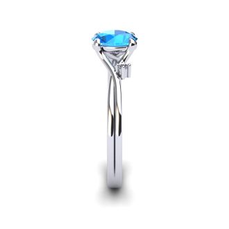 1/2 Carat Oval Shape Blue Topaz and Two Diamond Accent Ring In 14 Karat White Gold