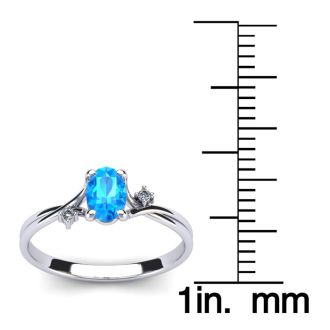 1/2 Carat Oval Shape Blue Topaz and Two Diamond Accent Ring In 14 Karat White Gold
