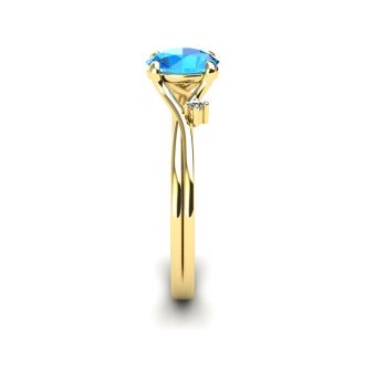 1/2 Carat Oval Shape Blue Topaz and Two Diamond Accent Ring In 14 Karat Yellow Gold