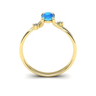 1/2 Carat Oval Shape Blue Topaz and Two Diamond Accent Ring In 14 Karat Yellow Gold