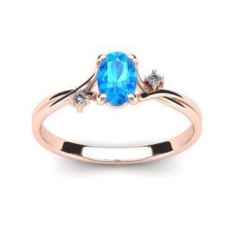 1/2 Carat Oval Shape Blue Topaz and Two Diamond Accent Ring In 14 Karat Rose Gold