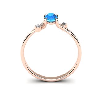 1/2 Carat Oval Shape Blue Topaz and Two Diamond Accent Ring In 14 Karat Rose Gold