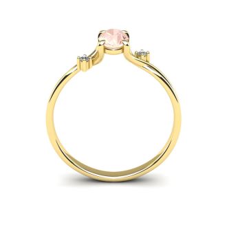 1/2 Carat Oval Shape Morganite and Two Diamond Accent Ring In 14 Karat Yellow Gold