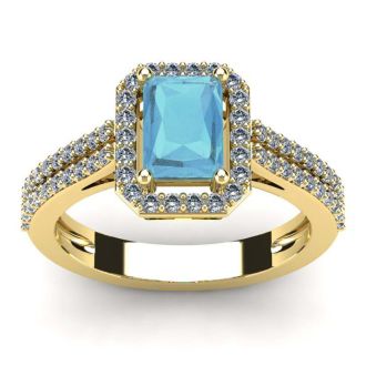 Aquamarine Ring: Aquamarine Jewelry: 1 1/3 Carat Aquamarine and Halo Diamond Ring In 14 Karat Yellow Gold