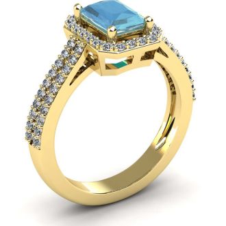 Aquamarine Ring: Aquamarine Jewelry: 1 1/3 Carat Aquamarine and Halo Diamond Ring In 14 Karat Yellow Gold