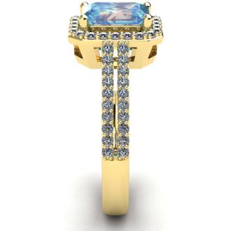 Aquamarine Ring: Aquamarine Jewelry: 1 1/3 Carat Aquamarine and Halo Diamond Ring In 14 Karat Yellow Gold