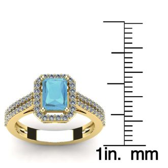 Aquamarine Ring: Aquamarine Jewelry: 1 1/3 Carat Aquamarine and Halo Diamond Ring In 14 Karat Yellow Gold