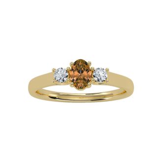 1/2 Carat Oval Shape Citrine and Two Diamond Ring In 14 Karat Yellow Gold