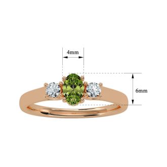 3/4 Carat Oval Shape Peridot and Two Diamond Ring In 14 Karat Rose Gold