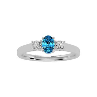 3/4 Carat Oval Shape Blue Topaz and Two Diamond Ring In 14 Karat White Gold