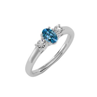 3/4 Carat Oval Shape Blue Topaz and Two Diamond Ring In 14 Karat White Gold