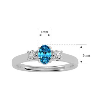 3/4 Carat Oval Shape Blue Topaz and Two Diamond Ring In 14 Karat White Gold