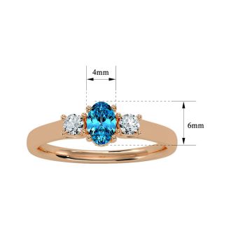 3/4 Carat Oval Shape Blue Topaz and Two Diamond Ring In 14 Karat Rose Gold