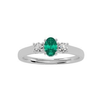 1/2 Carat Oval Shape Emerald and Two Diamond Ring In 14 Karat White Gold