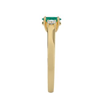 1/2 Carat Oval Shape Emerald and Two Diamond Ring In 14 Karat Yellow Gold