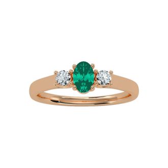 1/2 Carat Oval Shape Emerald and Two Diamond Ring In 14 Karat Rose Gold