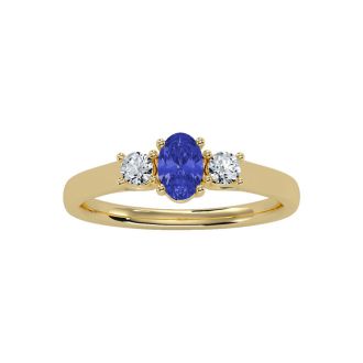 3/4 Carat Oval Shape Tanzanite and Two Diamond Ring In 14 Karat Yellow Gold