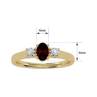 Garnet Ring: Garnet Jewelry: 3/4 Carat Oval Shape Garnet and Two Diamond Ring In 14 Karat Yellow Gold
