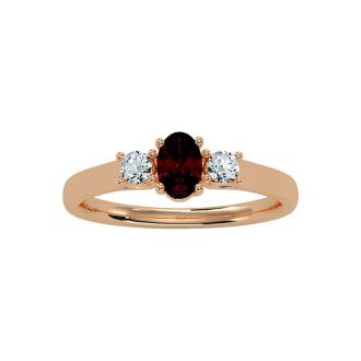 Garnet Ring: Garnet Jewelry: 3/4 Carat Oval Shape Garnet and Two Diamond Ring In 14 Karat Rose Gold