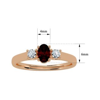 Garnet Ring: Garnet Jewelry: 3/4 Carat Oval Shape Garnet and Two Diamond Ring In 14 Karat Rose Gold