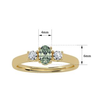 1/2 Carat Oval Shape Green Amethyst and Two Diamond Ring In 14 Karat Yellow Gold