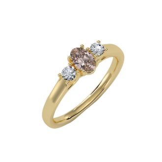 1/2 Carat Oval Shape Morganite and Two Diamond Ring In 14 Karat Yellow Gold