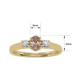 1/2 Carat Oval Shape Morganite and Two Diamond Ring In 14 Karat Yellow Gold