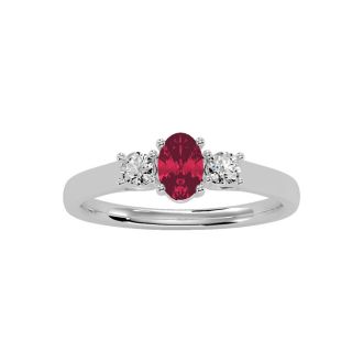 3/4 Carat Oval Shape Ruby and Two Diamond Ring In 14 Karat White Gold