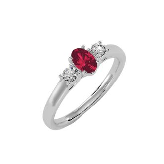 3/4 Carat Oval Shape Ruby and Two Diamond Ring In 14 Karat White Gold