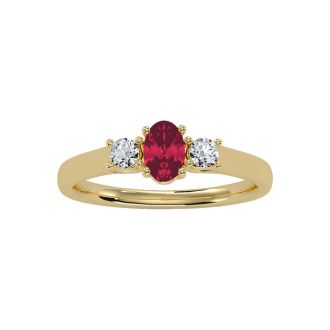 3/4 Carat Oval Shape Ruby and Two Diamond Ring In 14 Karat Yellow Gold