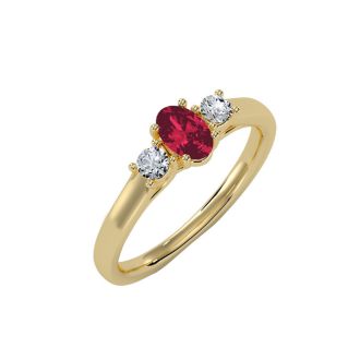 3/4 Carat Oval Shape Ruby and Two Diamond Ring In 14 Karat Yellow Gold