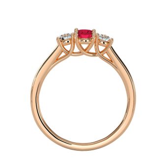 3/4 Carat Oval Shape Ruby and Two Diamond Ring In 14 Karat Rose Gold