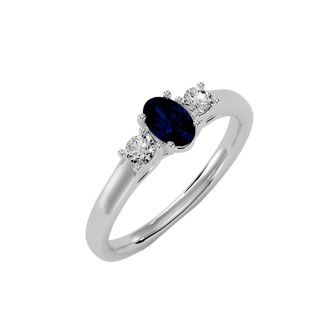 3/4 Carat Oval Shape Sapphire and Two Diamond Ring In 14 Karat White Gold