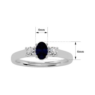 3/4 Carat Oval Shape Sapphire and Two Diamond Ring In 14 Karat White Gold