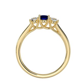 3/4 Carat Oval Shape Sapphire and Two Diamond Ring In 14 Karat Yellow Gold