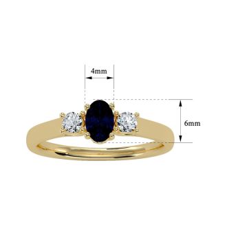 3/4 Carat Oval Shape Sapphire and Two Diamond Ring In 14 Karat Yellow Gold