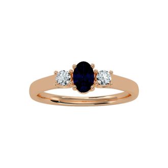 3/4 Carat Oval Shape Sapphire and Two Diamond Ring In 14 Karat Rose Gold