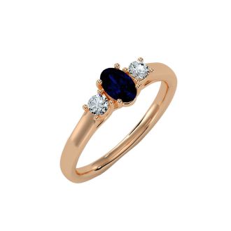 3/4 Carat Oval Shape Sapphire and Two Diamond Ring In 14 Karat Rose Gold