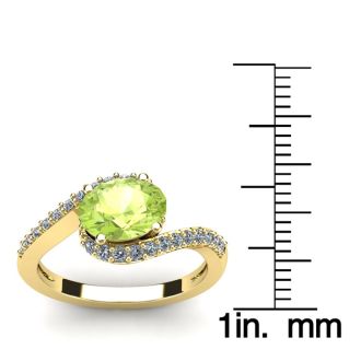 1 1/2 Carat Oval Shape Peridot and Halo Diamond Ring In 14 Karat Yellow Gold
