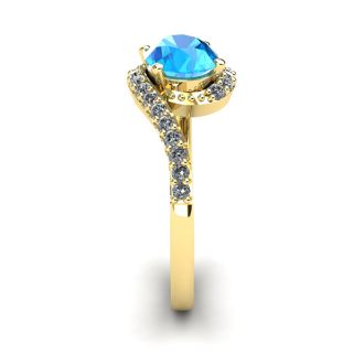 1 3/4 Carat Oval Shape Blue Topaz and Halo Diamond Ring In 14 Karat Yellow Gold