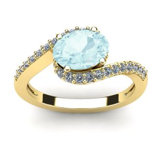 Aquamarine Ring: Aquamarine Jewelry: 1 1/2 Carat Oval Shape Aquamarine and Halo Diamond Ring In 14 Karat Yellow Gold