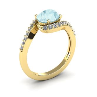 Aquamarine Ring: Aquamarine Jewelry: 1 1/2 Carat Oval Shape Aquamarine and Halo Diamond Ring In 14 Karat Yellow Gold