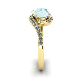 Aquamarine Ring: Aquamarine Jewelry: 1 1/2 Carat Oval Shape Aquamarine and Halo Diamond Ring In 14 Karat Yellow Gold