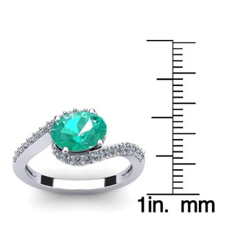 1 1/2 Carat Oval Shape Emerald and Halo Diamond Ring In 14 Karat White Gold