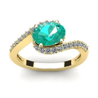 1 1/2 Carat Oval Shape Emerald and Halo Diamond Ring In 14 Karat Yellow Gold