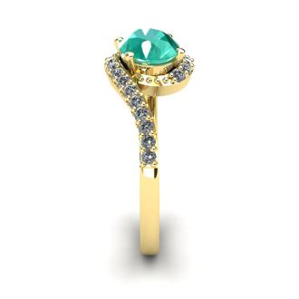 1 1/2 Carat Oval Shape Emerald and Halo Diamond Ring In 14 Karat Yellow Gold