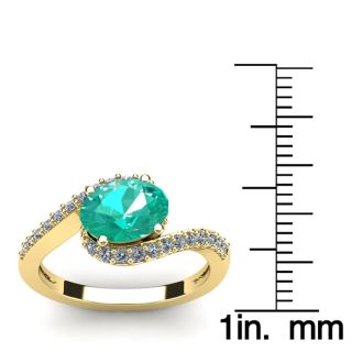 1 1/2 Carat Oval Shape Emerald and Halo Diamond Ring In 14 Karat Yellow Gold